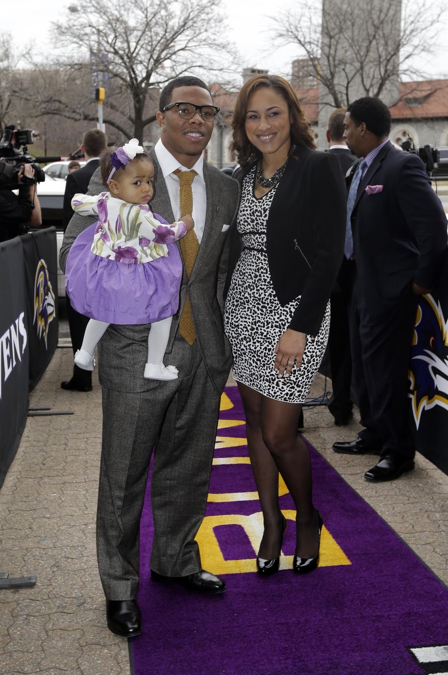 FILE - In this March 11, 2013 file photo, Baltimore Ravens running back Ray Rice, left, poses with his daughter, Rayven, and Janay Palmer as they arrive for a screening of a new film released on DVD that chronicles the team's championship NFL football season in Baltimore. Police in Atlantic City say Ray Rice and his fiance, Janay Palmer, were released on Saturday, Feb. 15, 2014, after they were arrested when an argument turned physical at the Revel Casino. (AP Photo/Patrick Semansky, File)