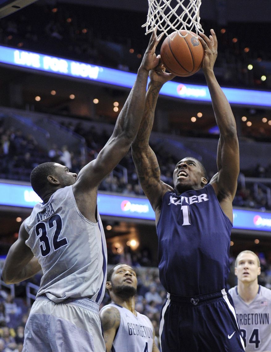 Xavier forward Jalen Reynolds (1) goes to the basket against Georgetown center Moses Ayegba (32) during the first half of an NCAA college basketball game, Saturday, Feb. 22, 2014, in Washington. (AP Photo/Nick Wass)