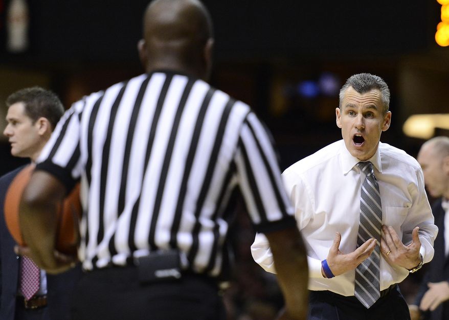 Florida head coach Billy Donovan talks with an official in the second half of an NCAA college basketball game against Vanderbilt, Tuesday, Feb. 25, 2014, in Nashville, Tenn. Florida won 57-54. (AP Photo/Mark Zaleski)