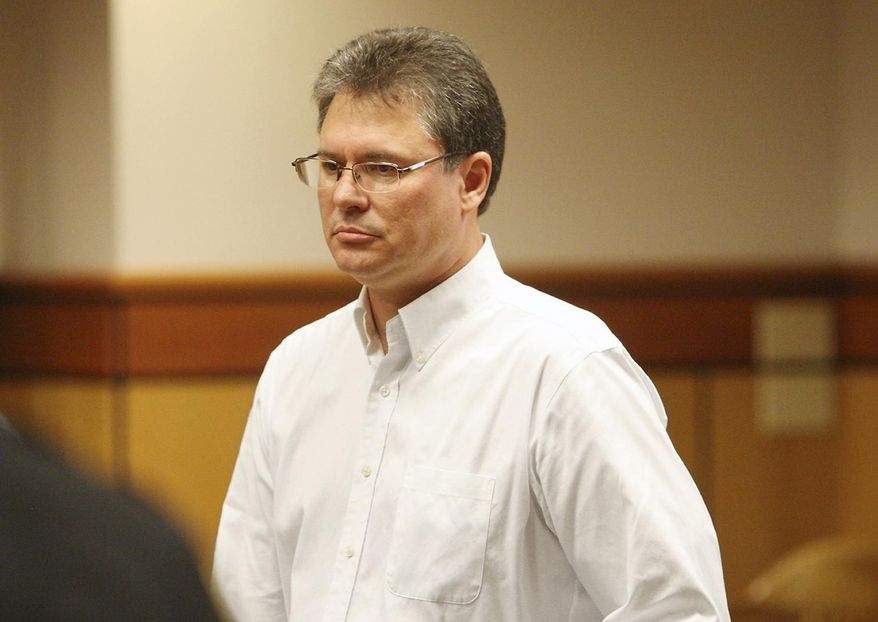 This Aug. 26, 2013 photo shows Stacey Rambold standing in a courtroom after sentencing by Judge G. Todd Baugh in Billings, Mont. Attorneys for Rambold, a former Montana teacher who raped a 14-year-old student argued Friday, Feb. 28, 2014, that his 30 days in prison were enough punishment, even as a judicial oversight panel sought the censure of Baugh, the judge in the case over what it called an unlawful sentence. Prosecutors want to send freed rapist Stacey Dean Rambold of Billings back to prison. They say he should have served a minimum of four years after pleading guilty last year to sexual assault without consent. (AP Photo/Billings Gazette, Paul Ruhter)