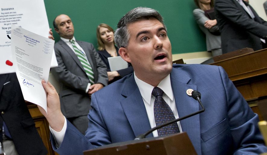 Rep. Cory Gardner, Colorado Republican, holds up a letter he wrote to Health and Human Services Secretary Kathleen Sebelius asking that she consider waiving Obamacare for the 4th Congressional District of Colorado, as she testified on Capitol Hill in Washington Oct. 30, 2013. (Associated Press) **FILE**