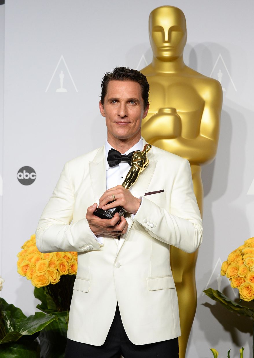 Matthew McConaughey holds the award for best actor for his role in the "Dallas Buyers Club" in the press room during the Oscars at the Dolby Theatre on Sunday, March 2, 2014, in Los Angeles. (Photo by Jordan Strauss/Invision/AP)