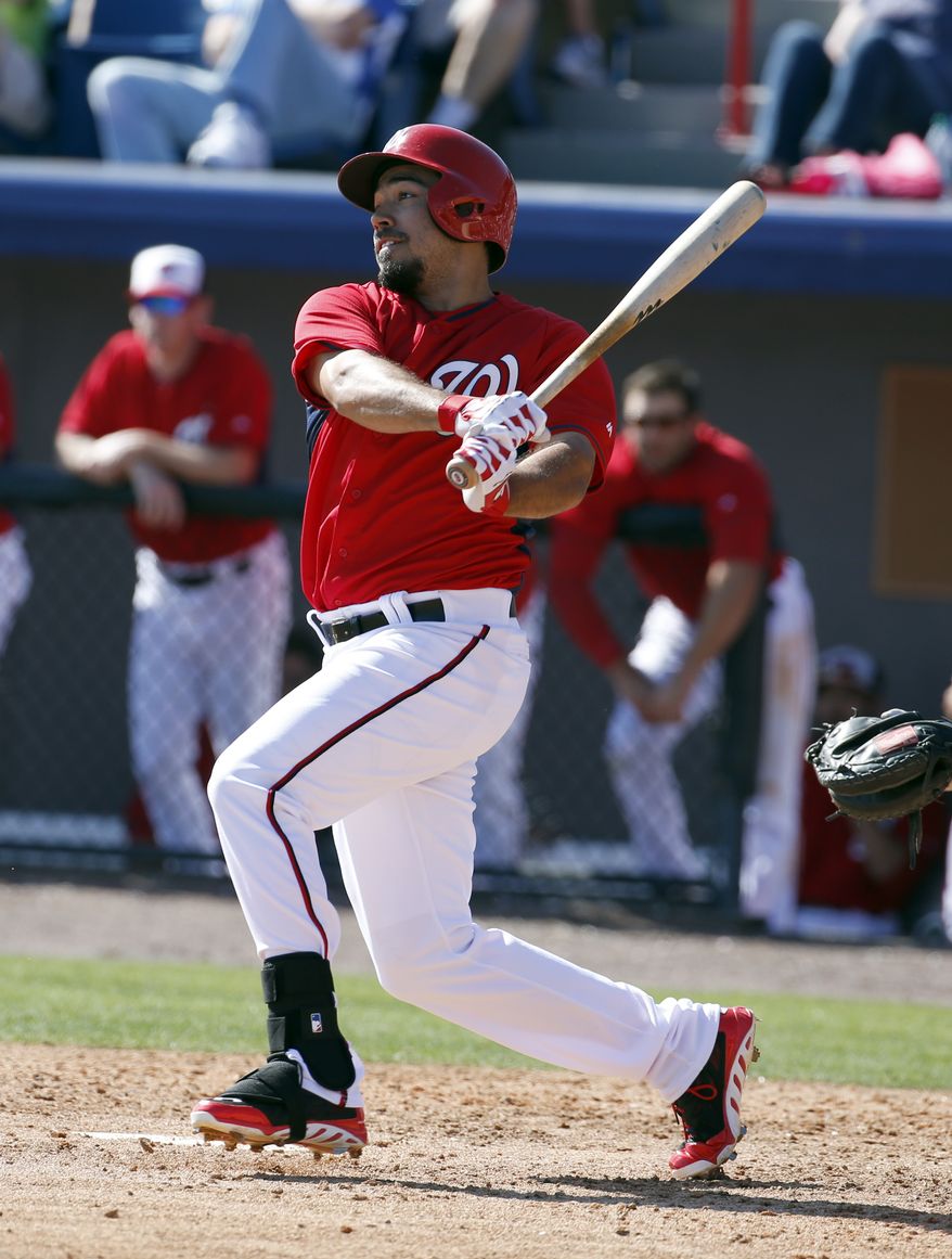 Washington Nationals second baseman Anthony Rendon (6) hits in a spring exhibition baseball game against the Atlanta Braves, Saturday, March 1, 2014, in Viera, Fla. The Nationals won 16-15. (AP Photo/Alex Brandon)
