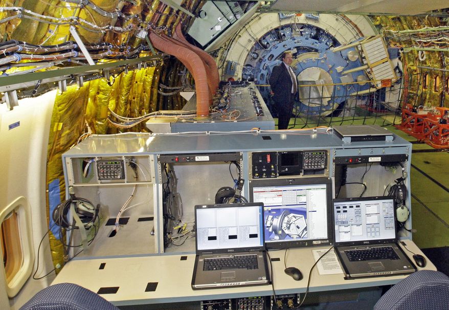 FILE - In this April 20, 2010, file photo, the telescope control console is seen inside the aircraft at the first public viewing of the Stratospheric Observatory for Infrared Astronomy (SOFIA), a cooperative venture between NASA and German scientists, where a 2.8-meter (98-inch) telescope has been mounted inside specially modified Boeing 747-SP, at a NASA Dryden Flight Research Center test facility in Palmdale, Calif. The control mechanism for the telescope is seen at rear. The White House released its budget on Tuesday, March 4, 2014, that proposes to mothball the observatory unless Germany and other partners can kick in more money. (AP Photo/Reed Saxon, File)