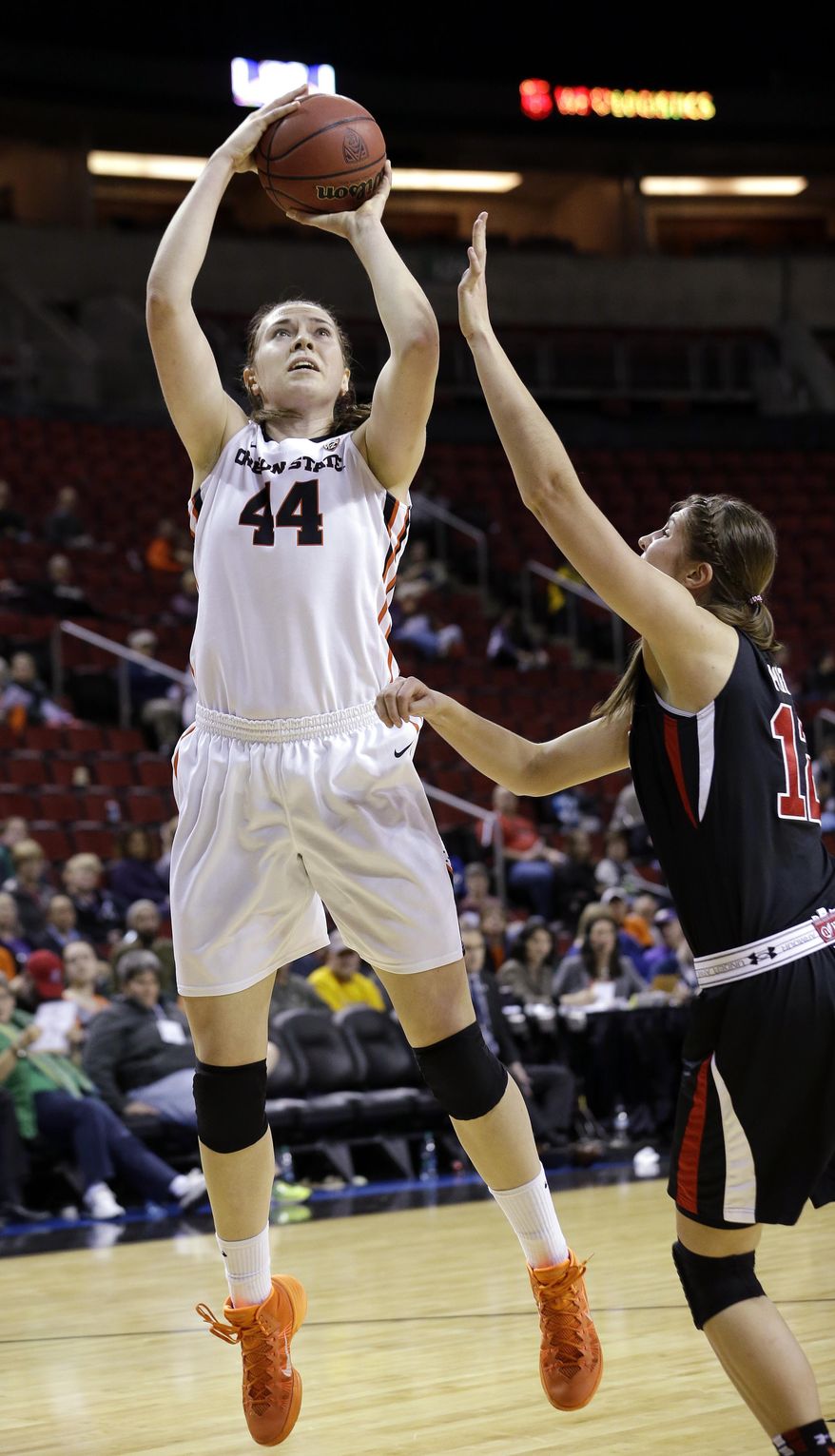 Oregon State's Ruth Hamblin (44) shoots over Utah's Emily Potter in the second half of an NCAA college basketball game in the Pac-12 women's tournament Friday, March 7, 2014, in Seattle. Oregon State won 50-35. (AP Photo/Elaine Thompson)