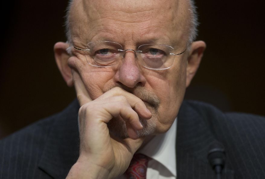 FILE - This Jan. 29, 2014 file photo shows Director of National Intelligence James Clapper on Capitol Hill in Washington. U.S. intelligence officials are planning an electronic monitoring system that would tap into government, financial and public databases to scan the behavior patterns of many of the 5 million government employees who hold secret clearances, according to current and former officials. The system draws on a Defense Department model in development for more than a decade, documents reviewed by the Associated Press show. (AP Photo/Pablo Martinez Monsivais, File)