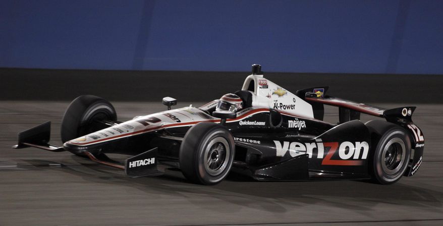 FILE - In this Oct. 19, 2013 file photo, Will Power (12), of Australia, races towards victory in the IndyCar auto race at the Auto Club Speedway, in Fontana, Calif. IndyCar has reached a multi-year agreement with Verizon that will make the telecommunications giant the title sponsor of the series. Verizon replaces former title sponsor Izod and its sponsorship of what will now be known as the Verizon IndyCar Series launches with the March 30 season opening race. (AP Photo/Alex Gallardo, File)