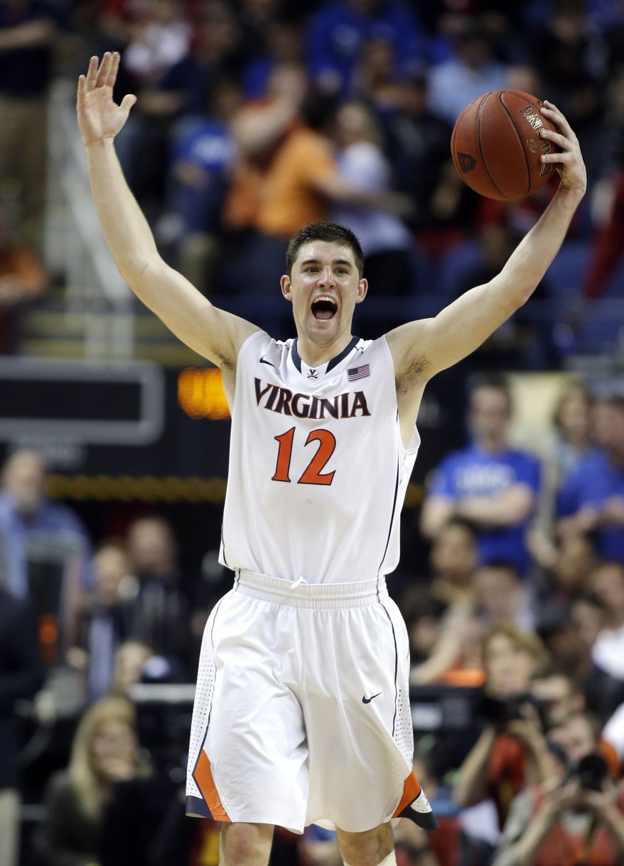 Virginia's Joe Harris (12) celebrates after defeating Duke in an NCAA college basketball game in the championship of the Atlantic Coast Conference tournament in Greensboro, N.C., Sunday, March 16, 2014. Virginia won 72-63. (AP Photo/Bob Leverone)