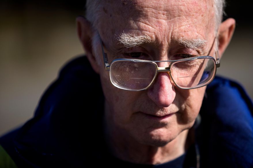 After spending the night at a Red Cross shelter, Reed Miller, 75, recounts the loss of his home in Oso, Wash., Sunday, March 23, 2014, at Post Middle School in Arlington, Wash. Miller was grocery shopping when he was alerted to the mudslide via a phone call. He said he still has not heard from his son. Over a dozen people are unaccounted for after a massive mudslide killed at least three people and destroyed homes, according to authorities Sunday. (AP Photo/seattlepi.com, Jordan Stead) MAGS OUT; NO SALES; SEATTLE TIMES OUT; TV OUT; MANDATORY CREDIT