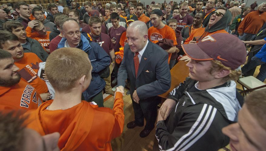 Virginia Tech's new men's head basketball coach, Buzz Williams, meets fans after an introductory press conference held at Cassell Coliseum, in Blacksburg, Virginia, Monday, March 24, 2014. (AP Photo/Roanoke Times, Don Petersen)