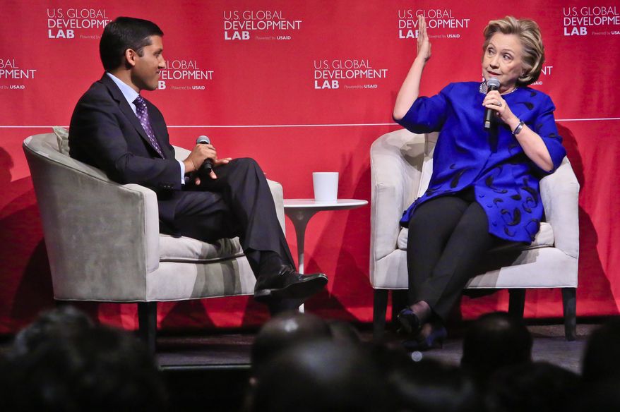 USAID Administrator Rajiv Shah, left, listens during a Q&A session with former Secretary of State Hillary Rodham Clinton after she delivered the keynote address at the launch of the U.S. Global Development Lab, on Thursday April 3, 2014 in New York. Congress and USAID are headed for a showdown over the Obama administration's creation of a Cuban Twitter communications network to undermine the communist government in Cuba. Shah is expected to testify on Tuesday before the Senate Appropriations State Department and foreign operations subcommittee. (AP Photo/Bebeto Matthews)