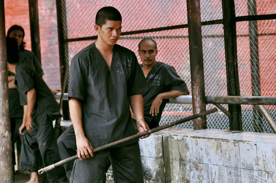 Iko Uwais, a renowned champion in the Indonesian pencak silat fighting style, gets to stretch out as an actor in "The Raid 2," a film packed with intense action sequences. (Sony Pictures Classic via Associated Press)