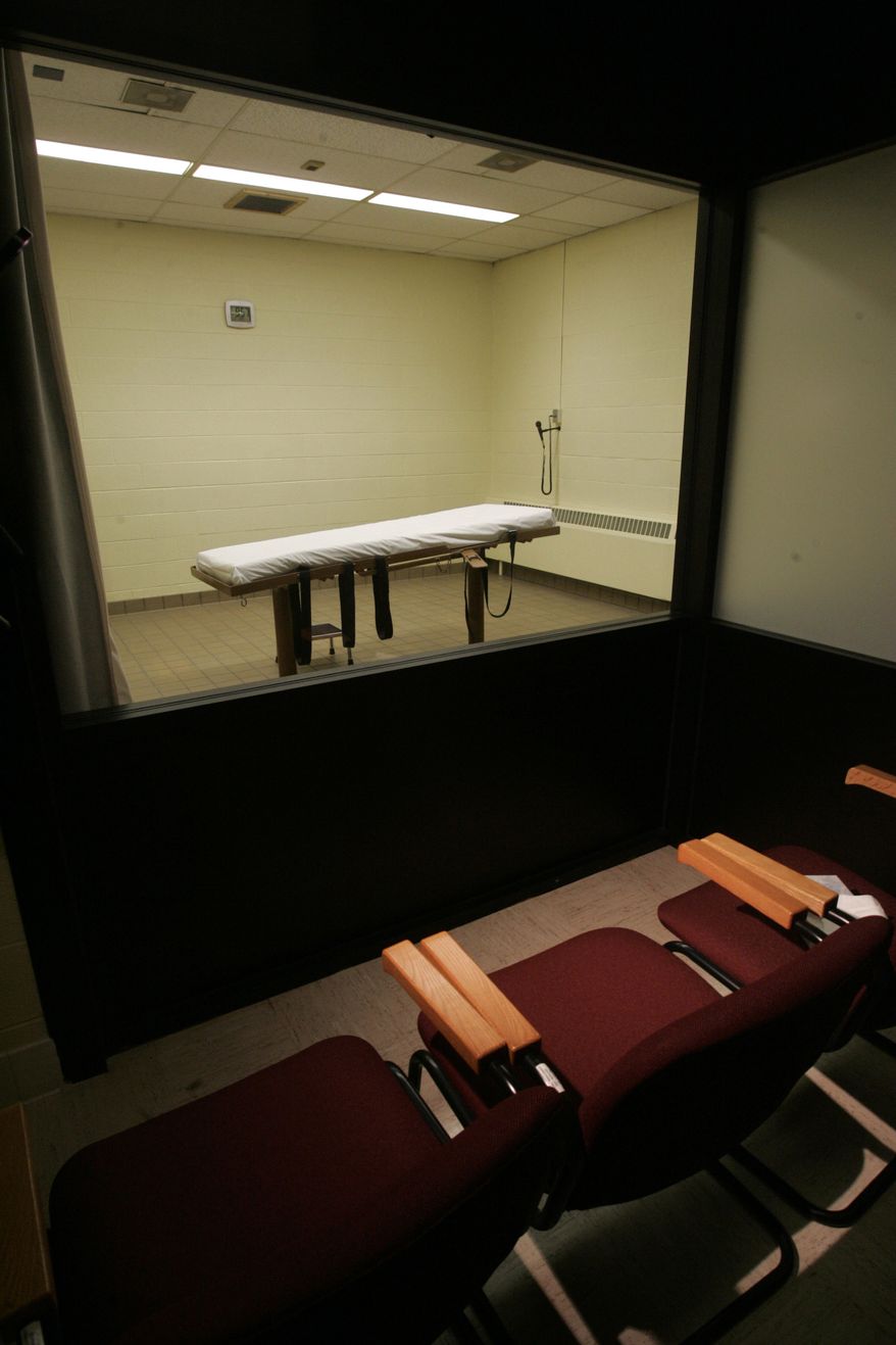 FILE - In this Nov. 2005, file photo is the witness room that adjoins the death chamber at the Southern Ohio Correctional Facility in Lucasville, Ohio. An Associated Press survey of the nation's 32 death penalty states found that the vast majority refuse to disclose the source of their execution drugs. While Ohio has been open about drugs purchased for executions, those cloaked in secrecy include states with some of the most active death chambers _ Texas, Florida, Oklahoma and Missouri among them. (AP Photo/Kiichiro Sato, File)