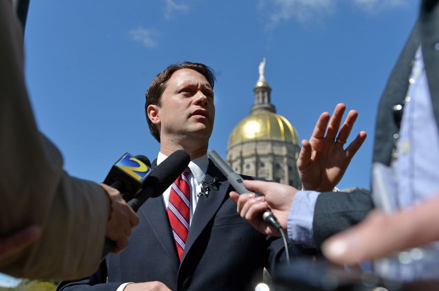 State Sen. Jason Carter, D-Decatur, who is running for governor of Georgia, speaks during a press conference outside the Capitol on Tuesday April 8, 2014. Carter called for an independent investigation into Gov. Nathan Deal's 2010 campaign. On Friday April 4, 2014 a Fulton County jury found the state ethics commission executive director, Stacey Kalberman, was unfairly forced from office as retribution for investigating Deal's 2010 campaign. (AP Photo/Atlanta Journal-Constitution, Brant Sanderlin) MARIETTA DAILY OUT; GWINNETT DAILY POST OUT; LOCAL TV OUT; WXIA-TV OUT; WGCL-TV OUT
