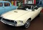 1969_Ford_Mustang,_white_coupe,_black_top