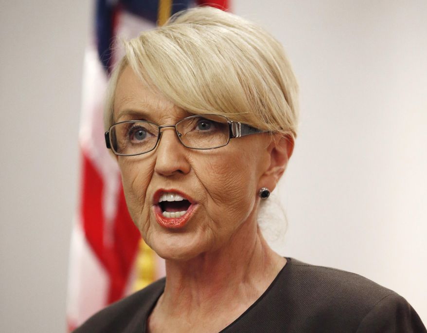 FILE - In this Feb. 26, 2014 file photo, Arizona Republican Gov. Jan Brewer speaks at a news conference at the Arizona Capitol in Phoenix. Brewer said Wednesday, March 12, 2014 that she won't seek a third term in office. The U.S. Supreme Court on Monday refused to hear an appeal of a blocked provision of Arizona's 2010 immigration enforcement law, dealing another blow to Gov. Jan Brewer in her effort to defend the law. The court declined to review the ruling that barred police from arresting people who harbor those living in the United States illegally. (AP Photo/Ross D. Franklin, File)