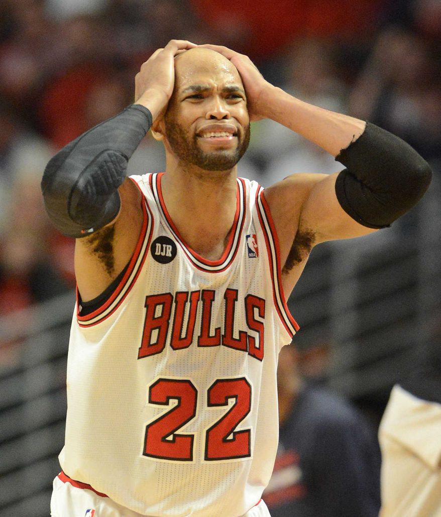 Chicago Bulls forward Taj Gibson (22) reacts as things start going the Wizards' way during Game 2 in an opening-round NBA basketball playoff series Tuesday, April 22, 2014, in Chicago. The Wizards won 101-99. (AP Photo/Daily Herald, Rick West)