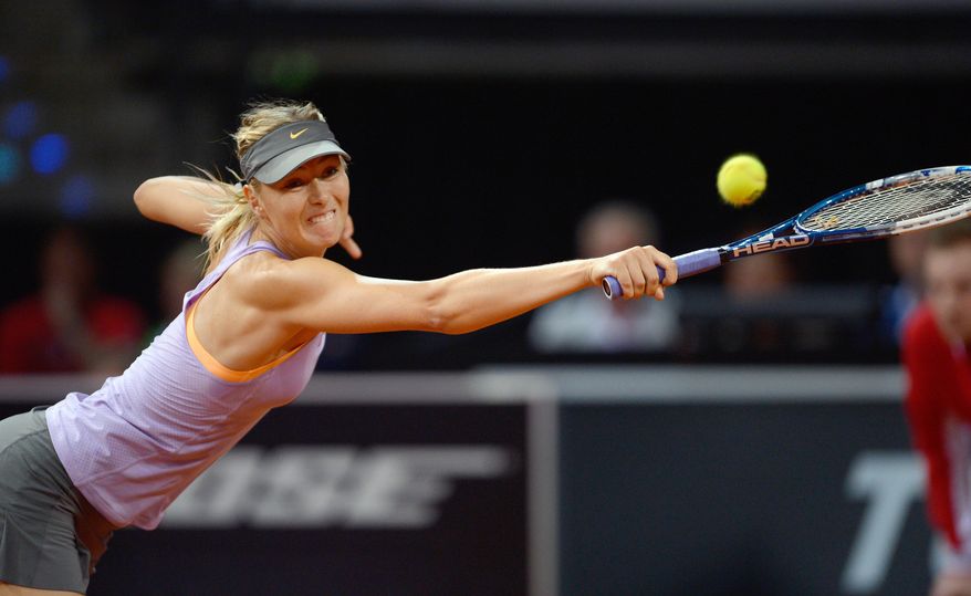 Russia's Maria Sharapova returns the ball to Serbia's Ana Ivanovic during their final match at the Porsche tennis Grand Prix in Stuttgart, Germany, Sunday, April 27, 2014. (AP Photo/dpa, Daniel Maurer)