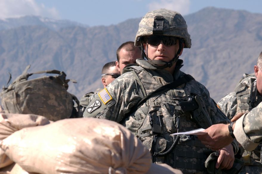 In a Feb. 17, 2008 photo provided by the South Carolina National Guard, U.S. Army Brig. Gen. Robert E. Livingston, Jr., Task Force Commander of Combined Joint Task Force Phoenix VI, visits a police observation post on the Afghanistan-Pakistan border during Operation Enduring Freedom in Kunar Province, Afghanistan, before the 2008 Taliban spring campaign. Livingston is campaigning in a suit and tie these days for a second term as the state's adjutant general.South Carolina is the only state in the nation where voters choose their top military officer in a general election. (AP Photo/U.S. Army National Guard,Corporal Roberto DiGovine)