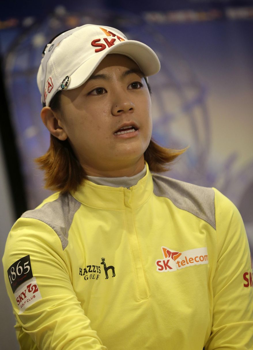Na Yeon Choi, of South Korea, answers a reporters question after finishing the first round of the ShopRite LPGA Classic golf tournament in Galloway Township, N.J., Friday, May 30, 2014. . (AP Photo/Mel Evans)