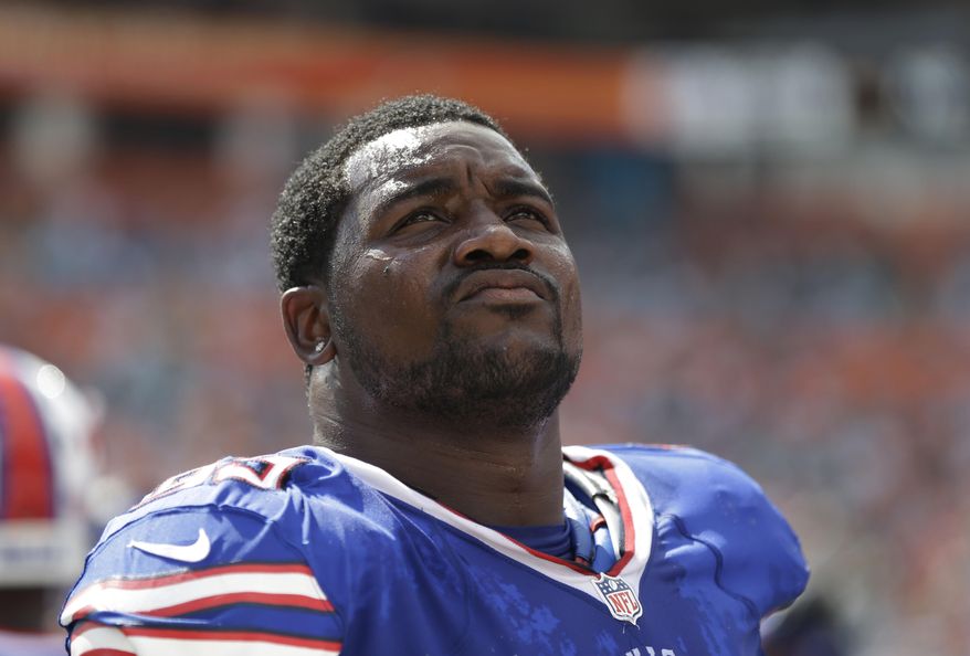 FILe - This Oct. 20, 2013 file photo shows Buffalo Bills defensive tackle Marcell Dareus (99) looking up during the first half of an NFL football game against the Miami Dolphins in Miami Gardens, Fla. Dareus will miss the next two weeks of voluntary practices to take time off from football in a bid to get his life and career on track following his latest off-field legal issue. Coach Doug Marrone made the announcement after practice Tuesday, June 3, 2014, four days after Dareus crashed his Jaguar into a tree while allegedly racing another car not far from the Bills' stadium. (AP Photo/Lynne Sladky, File)