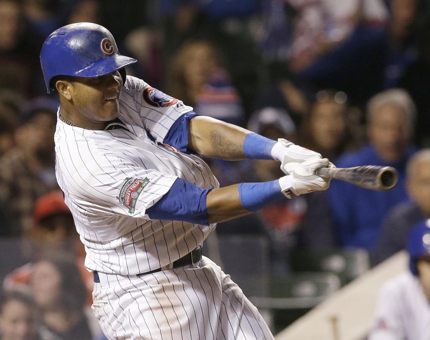 Chicago Cubs' Starlin Castro hits two-run single during the fifth inning of a baseball game against the New York Mets in Chicago, Wednesday, June 4, 2014. (AP Photo/Nam Y. Huh)