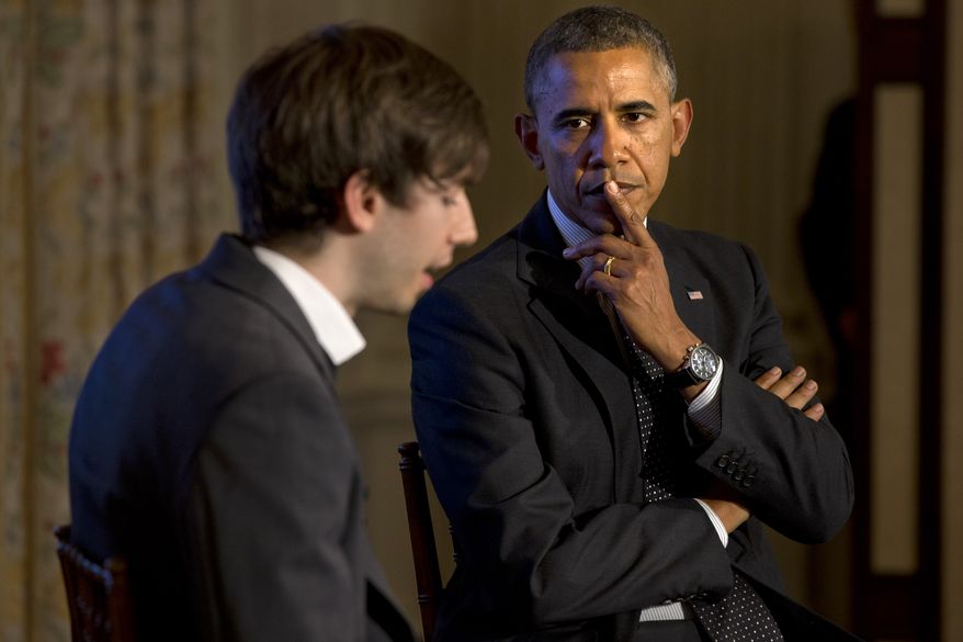 President Barack Obama listens to a question submitted on Tumblr, read by Tumblr Founder and CEO David Karp, left, during a Tumblr forum, Tuesday, June 10, 2014, in the State Dining Room of the White House in Washington. (AP Photo/Jacquelyn Martin)