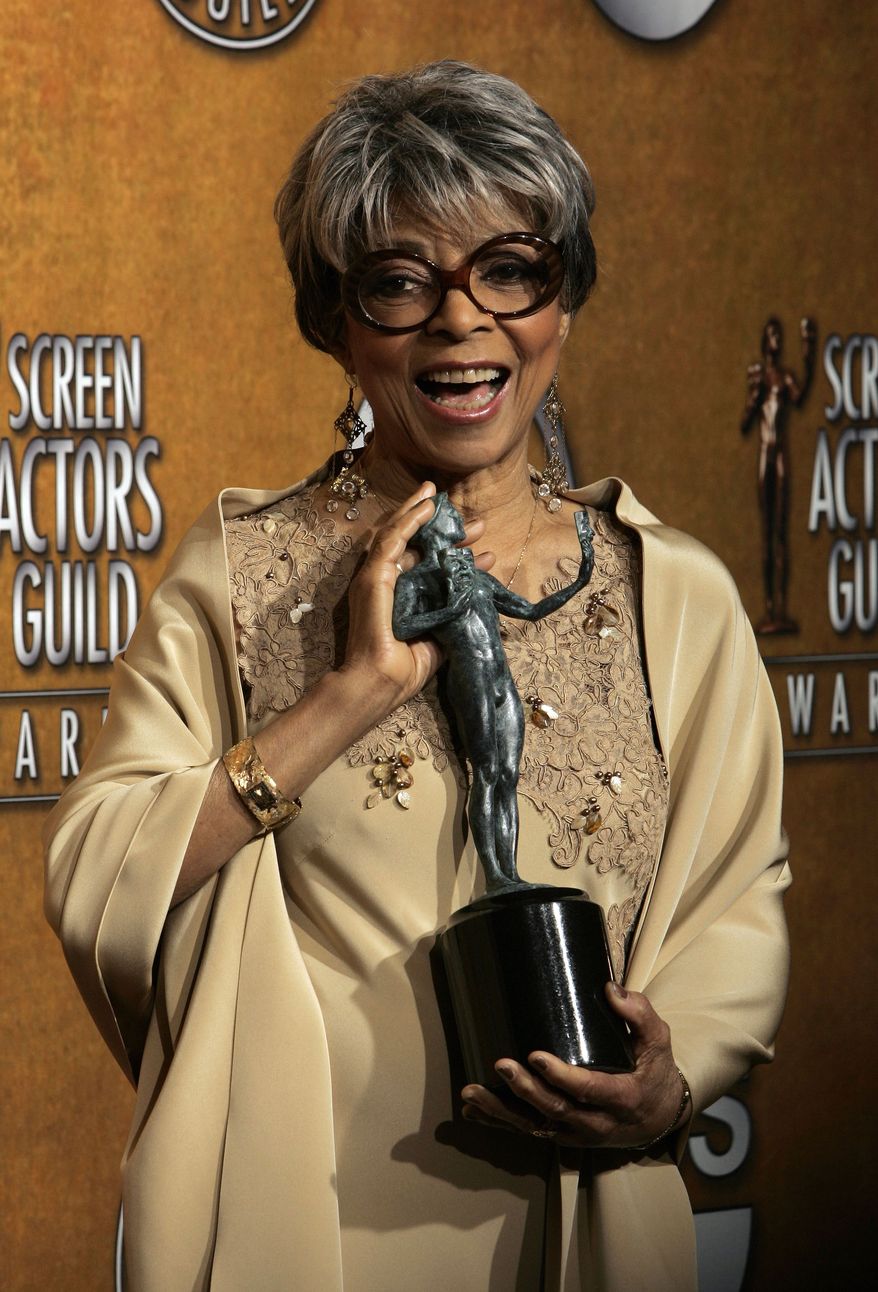 FILE - In this Jan. 27, 2008 file photo, Ruby Dee poses with the award for outstanding performance by a female actor in a supporting role for her work in "American Gangster" at the 14th Annual Screen Actors Guild Awards, in Los Angeles. Dee, an acclaimed actor and civil rights activist whose versatile career spanned stage, radio television and film, has died at age 91, according to her daughter. Nora Davis Day told The Associated Press on Thursday, June 12, 2014, that her mother died at home at New Rochelle, New York, on Wednesday night. (AP Photo/Reed Saxon, file)