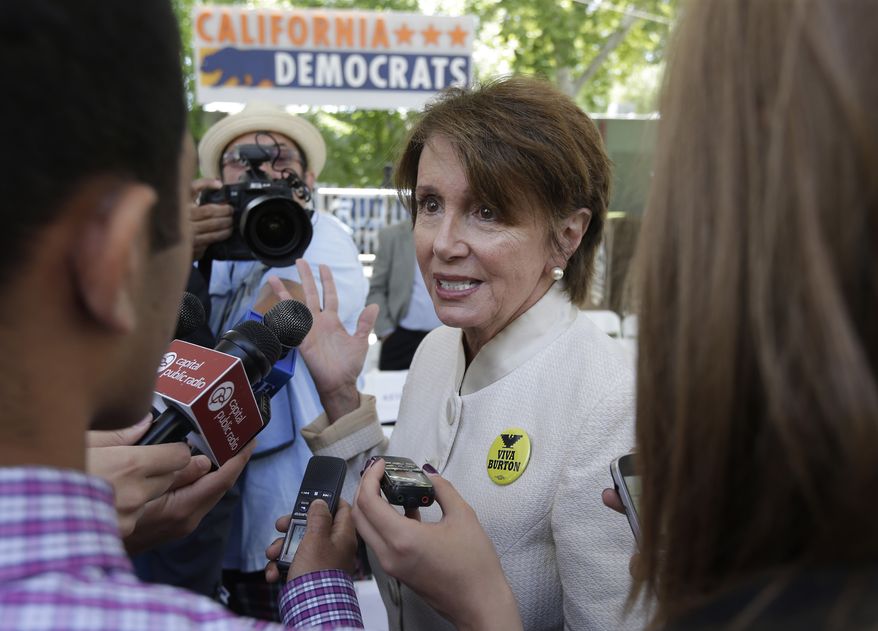 House Minority Leader Nancy Pelosi talks with reporters after attending the opening of the new California Democratic Party headquarters in Sacramento, Calif., Monday, June 16, 2014. (AP Photo/Rich Pedroncelli)