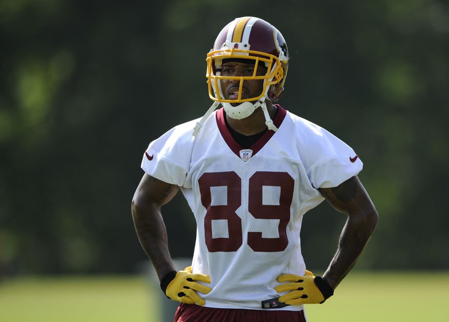 Washington Redskins wide receiver Santana Moss (89) looks on during NFL football minicamp, Wednesday, June 18, 2014, in Ashburn, Va. (AP Photo/Nick Wass)