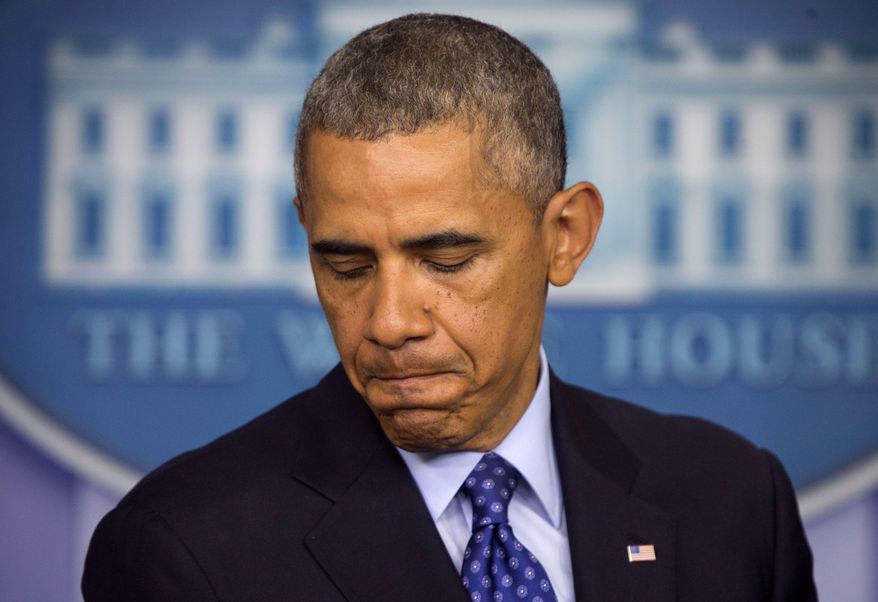 ** FILE ** This June 19, 2014, file photo shows President Barack Obama pausing as he talks about the situation in Iraq. (AP Photo/Pablo Martinez Monsivais, File)