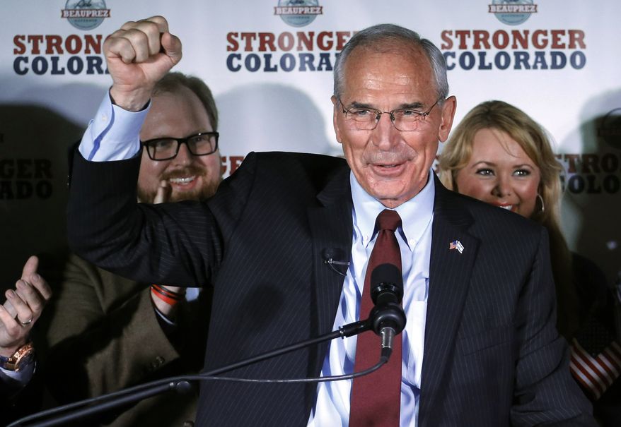 Republican gubernatorial candidate winner Bob Beauprez gestures with a closed fist as he addresses supporters at an election party in Denver on Tuesday, June 24, 2014. Eight years after running unsuccessfully for governor, the former congressman defeated three other Republicans, including former U.S. Rep. Tom Tancredo, for the nod to challenge Democratic Gov. John Hickenlooper in November. (AP Photo/Ed Andrieski)