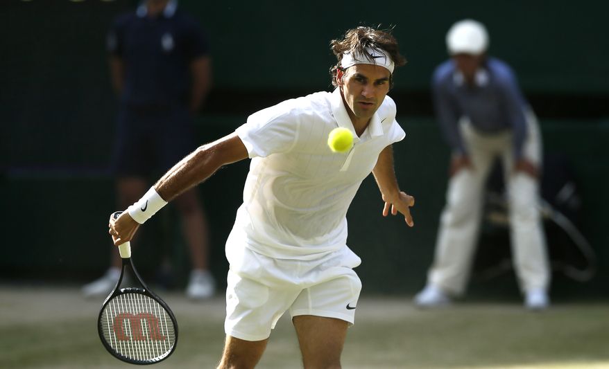 Roger Federer of Switzerland watches a return over the net to Milos Raonic of Canada during their men's singles semifinal match at the All England Lawn Tennis Championships in Wimbledon, London, Friday, July 4, 2014. (AP Photo/Ben Curtis)