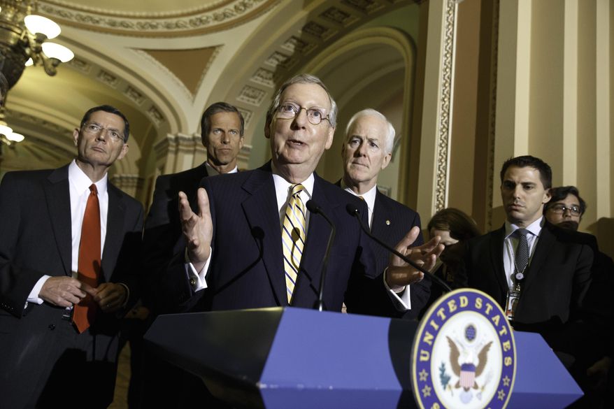 Senate Minority Leader Mitch McConnell of Ky., center, talks to reporters about competing bills from the Democrats and Republicans on employee health coverage and birth control under the Affordable Care Act, a subject that the Supreme Court ruled on recently in the so-called Hobby Lobby case, Tuesday, July 15, 2014, during a news conference on Capitol Hill in Washington. From left are, Sen. John Barrasso, R-Wyo., Sen. John Thune, R-S.D., McConnell and Senate Minority Whip John Cornyn of Texas. (AP Photo/J. Scott Applewhite)