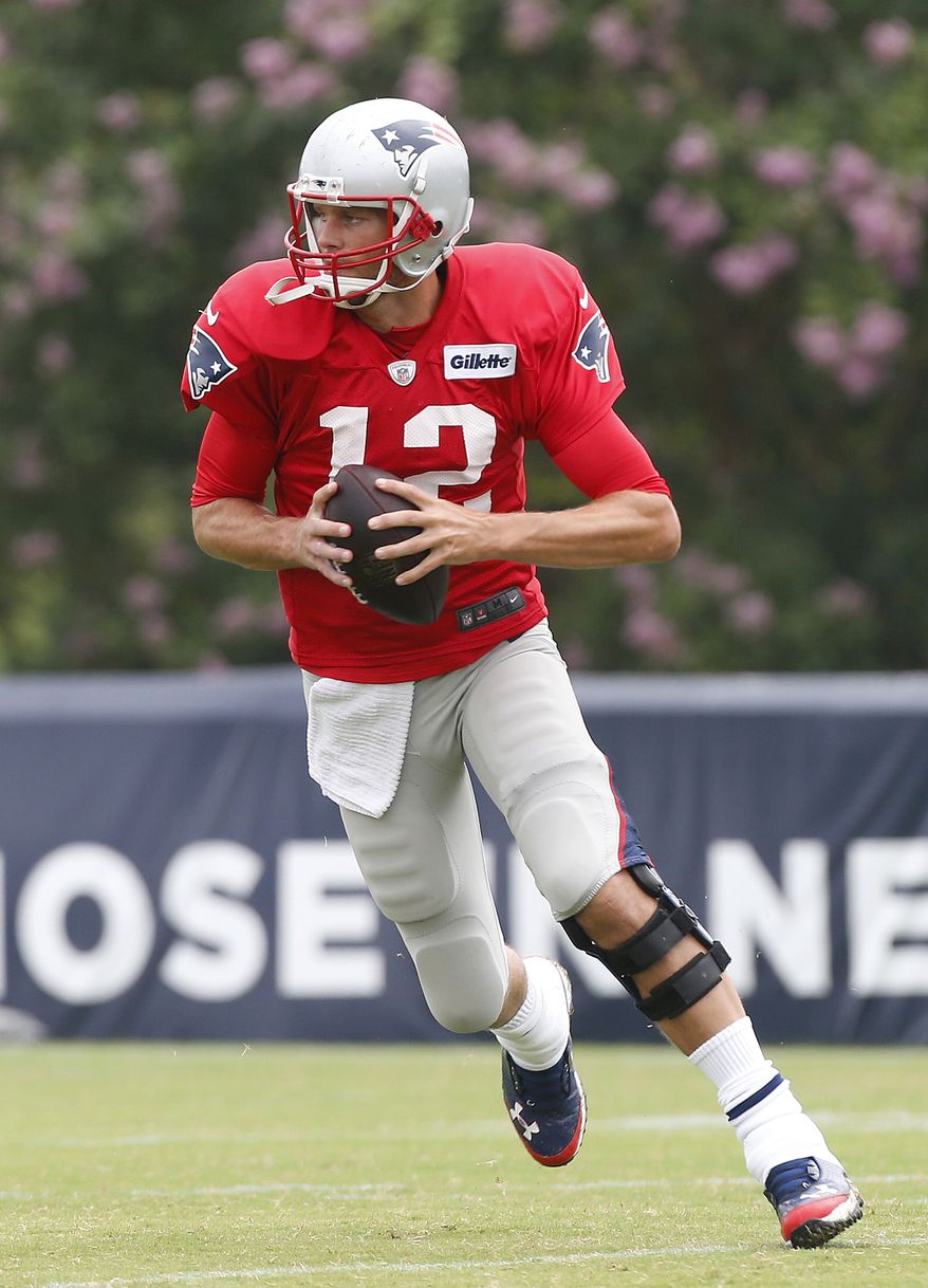 Patriots QB Tom Brady looks to pass the ball during practice at the Redskins Training Camp in Richmond, Va., Monday, Aug. 4, 2014. (AP Photo/Richmond Times-Dispatch, Alexa Welch Edlund)