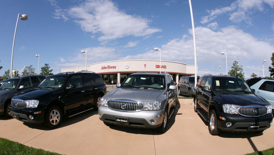 FILE - In this Aug. 27, 2006 file photo, a trio of unsold 2006 Buick Rainier sports utility vehicles sits in front of a Buick dealership in the southeast Denver suburb of Lone Tree, Colo. General Motors' troubles with safety recalls have surfaced in another case, this time with the company recalling a group of SUVs, including the 2006 Buick Rainier, for a third time to fix power window switches that can catch fire. (AP Photo/David Zalubowski, File)
