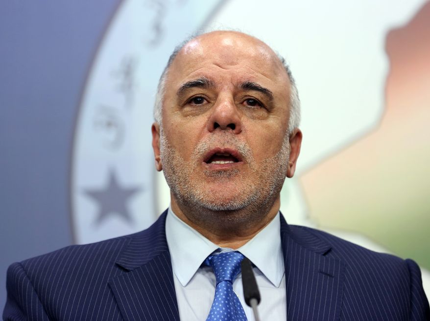 FILE - In this Tuesday, July 15, 2014 file photo, Shiite lawmaker and Deputy Parliament Speaker Haider al-Abadi speaks to the media after an Iraqi parliament session in Baghdad. On Monday, Aug. 11, 2014, Iraq's largest coalition of Shiite political parties chose al-Ibadi to be its candidate to lead the government in a major defeat for incumbent Prime Minister Nouri al-Maliki just hours after he declared himself the rightful candidate and put troops on the street. Critics say the Shiite al-Maliki contributed to the crisis by monopolizing power and pursuing a sectarian agenda that alienated the country's Sunni and Kurdish minorities. (AP Photo/Hadi Mizban, File)