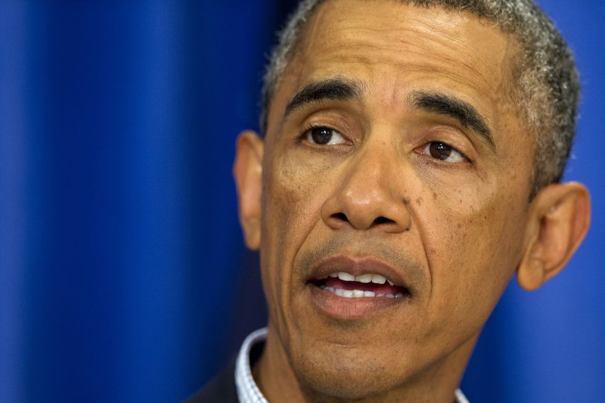 President Barack Obama speaks about the situations in Iraq and in Ferguson, Mo., Thursday, Aug. 14, 2014, in Edgartown, Mass., during his family vacation on the island of Martha's Vineyard. (AP Photo/Jacquelyn Martin)