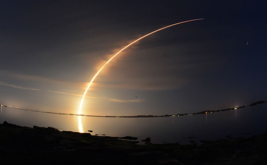 A SpaceX Falcon 9 rocket flies through Brevard County skies in this view from Melbourne after its liftoff from Cape Canaveral Air Force Station Sunday, March 1, 2015.  The rocket is carrying a pair of commercial communications satellites.  (AP Photo/Florida Today, Craig Bailey)