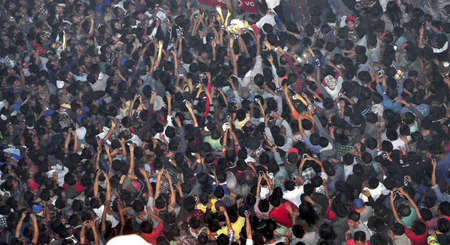[u&#39;In this Friday, March 6, 2015 photo, members of a mob raise their hands to take photographs of a man, top center, accused of rape after he was lynched and hung in the city landmark Clock Tower in Dimapur, in the northeastern Indian state of Dimapur. Several thousand people overpowered security at Dimapur Central Prison in Nagaland on Thursday, and seized the rape suspect, whom they also accused of being an illegal migrant from Bangladesh. They pelted him with stones and beat him to death, said police Constable Sunep Aier. (AP Photo/Imojen I Jamir)&#39;, u&#39;In this Thursday, March 5, 2015 photo, members of a mob raise their hands to take photos of a man, top center, accused of rape after he was lynched and hung in the city landmark Clock Tower in Dimapur, in the northeastern Indian state of Nagaland. Several thousand people overpowered security at Dimapur Central Prison in Nagaland on Thursday, and seized the rape suspect, whom they also accused of being an illegal migrant from Bangladesh. They pelted him with stones and beat him to death, said police Constable Sunep Aier. (AP Photo/Imojen I Jamir)&#39;]