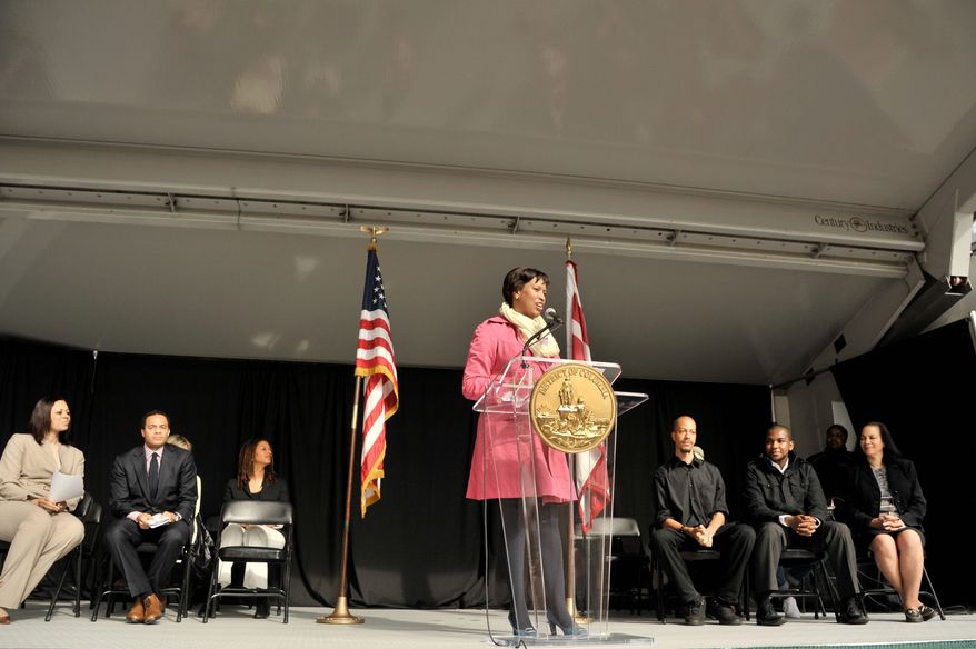 Mayor Muriel Bowser with other dc political figures speaks during the dedication ceremony of the Jesse Owens Mural at The Reeves Center in Washington DC on April 10, 2015. The mural was designed by a group of students from The Duke Ellington School of the Arts. Photo by Kris Connor for Focus Features