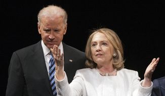 In this April 2, 2013, file photo Vice President Joe Biden and former Secretary of State Hillary Rodham Clinton are seen in Washington. (AP Photo/Cliff Owen, File)