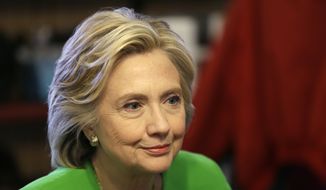 Hillary Rodham Clinton, who resigned from the Clinton Foundation's board, has faced mounting criticism over the charity's ties to foreign governments. (Associated Press) ** FILE **