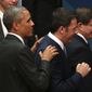 In this Nov. 15, 2014, file photo, U.S. President Baravk Obama left, puts his hands on the shoulders of Prime Minister of Italy Matteo Renzi after the family photo session of the G-20 summit in Brisbane, Australia. Obama will host Renzi at the White House on Friday, April 17, 2015, to compare notes on a range of issues, including Ukraine, Libya and Islamic State militants.  (AP Photo/Rob Griffith, File)