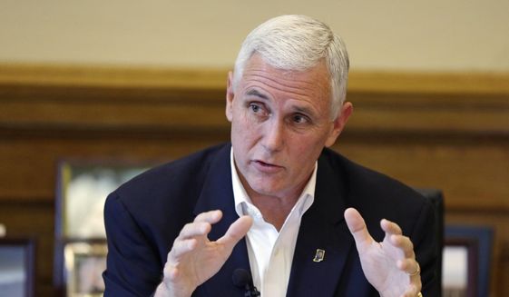 Indiana Gov. Mike Pence discusses the legislative session that ended the day before during a news conference at the Statehouse in Indianapolis, in this April 30, 2015, file photo. (AP Photo/Michael Conroy)