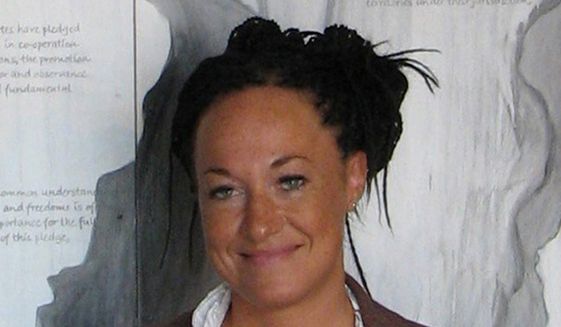 Rachel Dolezal is president of the Spokane chapter of the NAACP, chair of the city&#39;s Office of Police Ombudsman Commission, and an adjunct professor at Eastern Washington University. (Associated Press)