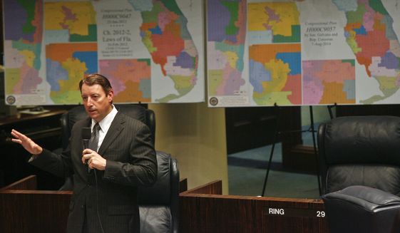 Senate Reapportionment Chairman Sen. Bill Galvano, R-Bradenton discusses an amendment on the floor of the Senate Monday, August 11, 2014, at the Capitol in Tallahassee, Fla. Behind him are maps of the 2012 Florida congressional districts, left, and the redrawn districts he is proposing in Senate Bill 2. Legislators are meeting for a rare summer one-week special session, to redraw the boundary lines of two congressional districts ruled unconstitutional last month, and have a Friday deadline for a resolution. (AP Photo/Phil Sears) **FILE**