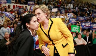 Huma Abedin, who has been at Hillary Rodham Clinton's side as her personal assistant or "body woman" since the 2008 presidential race, faced criticism for standing by her husband, former Rep. Anthony Weiner, after sexting scandals that damaged his political career. She now has to defend her own actions with the Clinton Foundation and the State Department email scandal. (Associated Press) ** FILE **