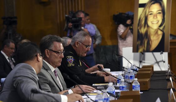 Jim Steinle, second from left, father of Kathryn Steinle, in photograph, testifies next to Montgomery County (Md.) Police Department. Chief J. Thomas Manger, right, before a Senate Judiciary hearing to examine the Administration&#39;s immigration enforcement policies, in Washington, Tuesday, July 21, 2015. Kathryn Steinle was killed on a San Francisco pier, allegedly by a man previously deported several times. (AP Photo/Molly Riley)