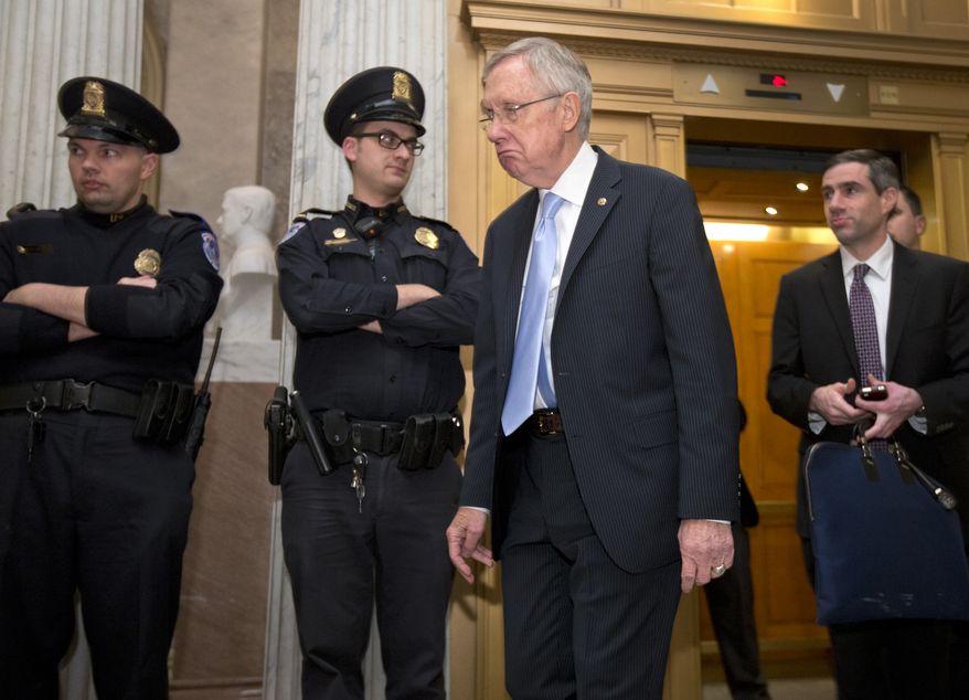 Senate Majority Leader Harry Reid of Nev., walks from an elevator on Capitol Hill in Washington, Tuesday, Nov. 18, 2014. The U.S. Senate has rejected a proposal to fast-track the approval of the controversial Keystone XL pipeline. (AP Photo/Carolyn Kaster)